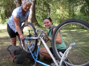 Our friend Wendy & I changing a tire along the Kettle Valley route